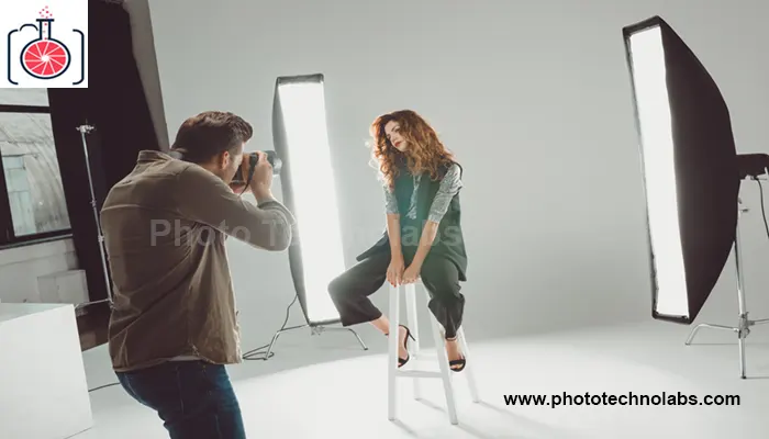 Professional photographer shooting model in studio